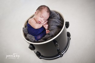newborn in a drum photos